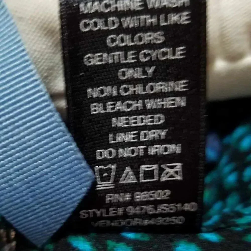 BKE Black Blue Green Top with a cut out in the back size Medium